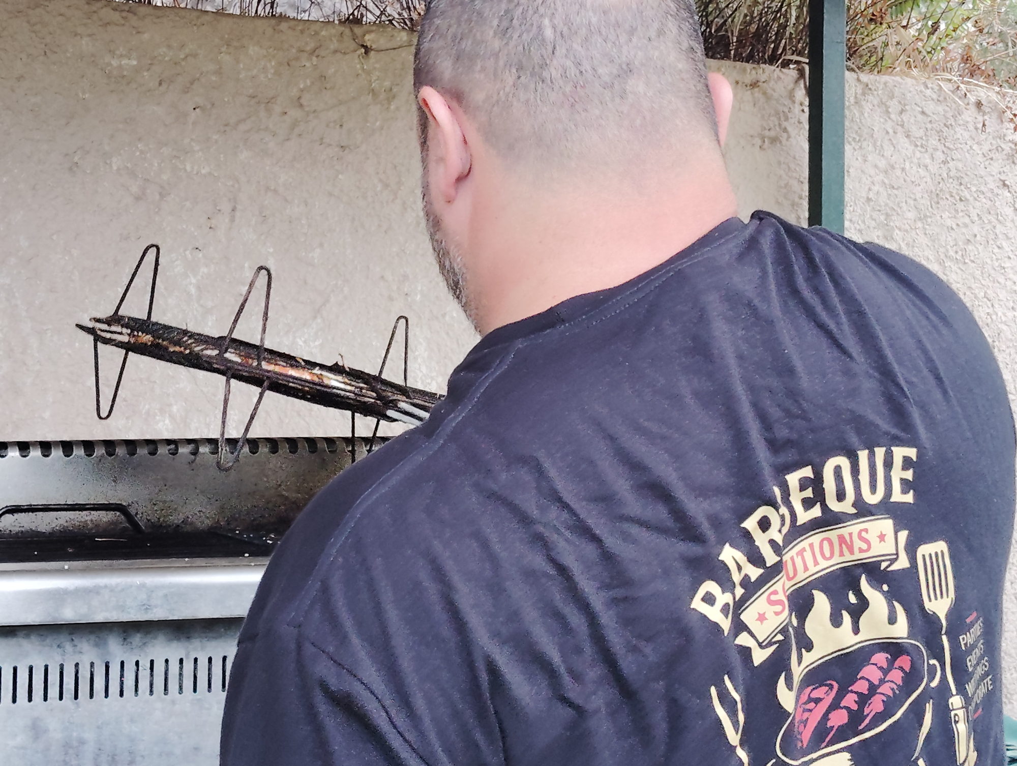 Angelos Panagopoulos at the grill during a private BBQ in Corfu