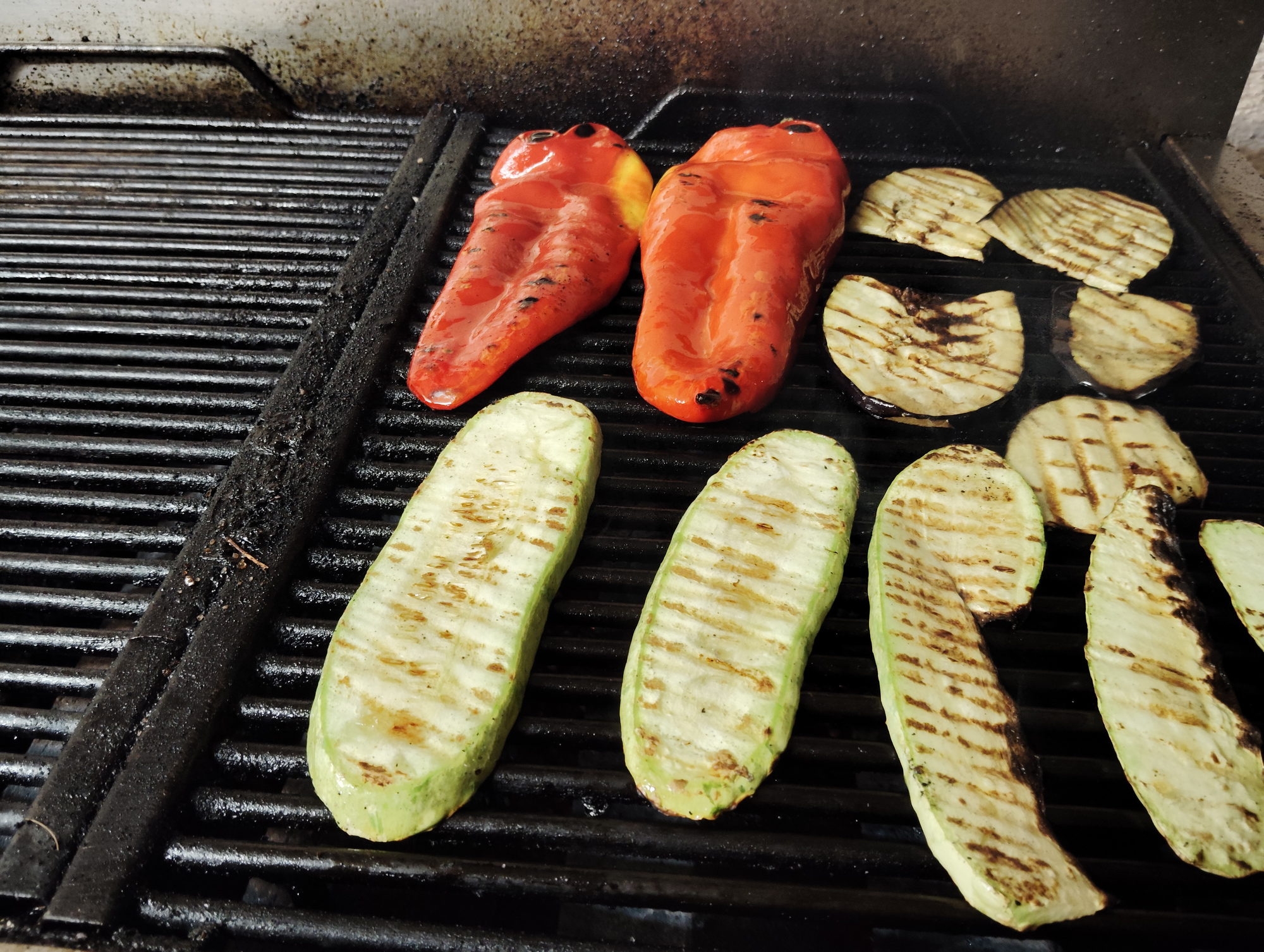 Grilled courgette, aubergine and red peppers marked by the grill bars